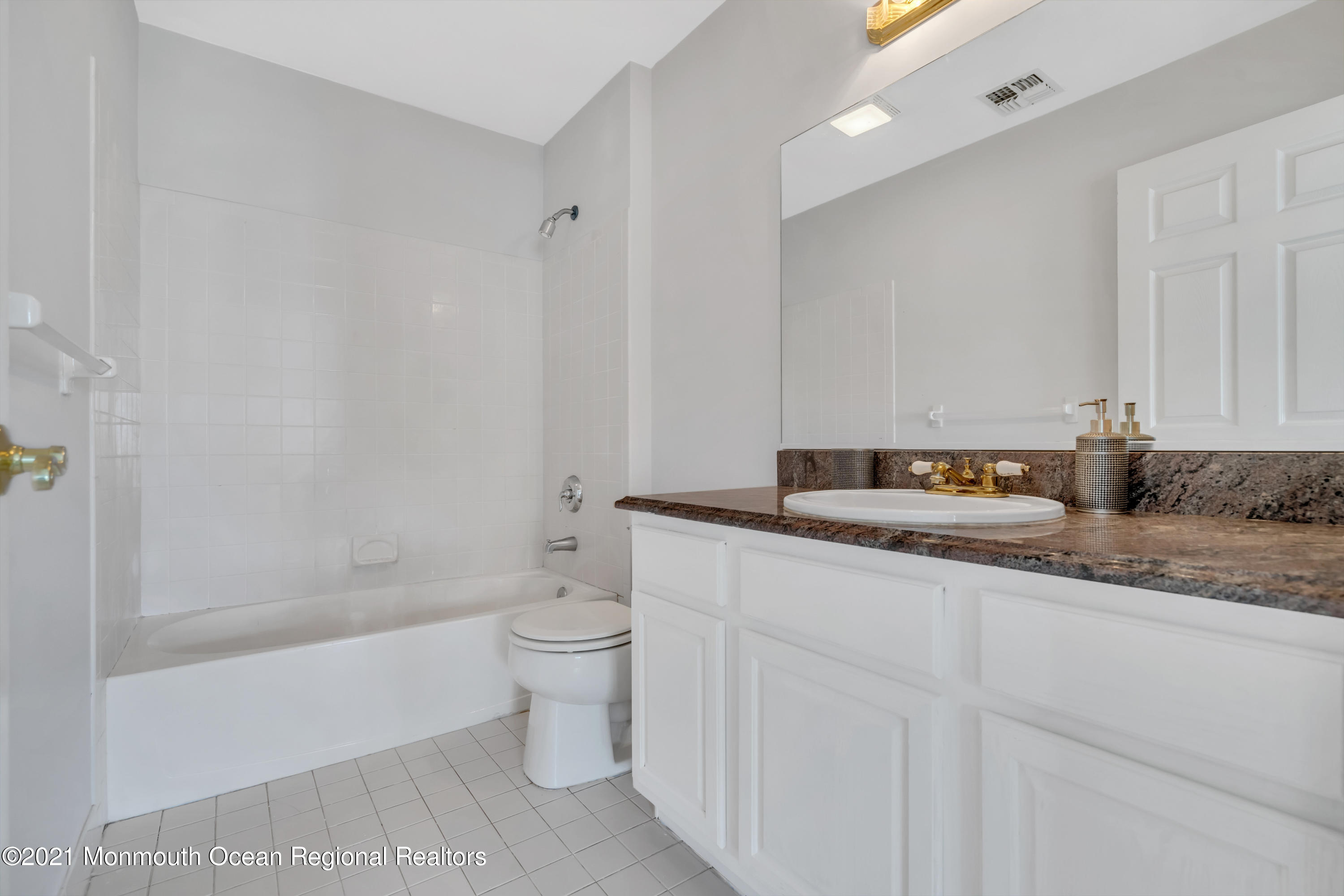 20 Highland Drive Jackson, NJ 08527 - Photo 33 of 62 a bathroom with a granite countertop sink a toilet and bathtub