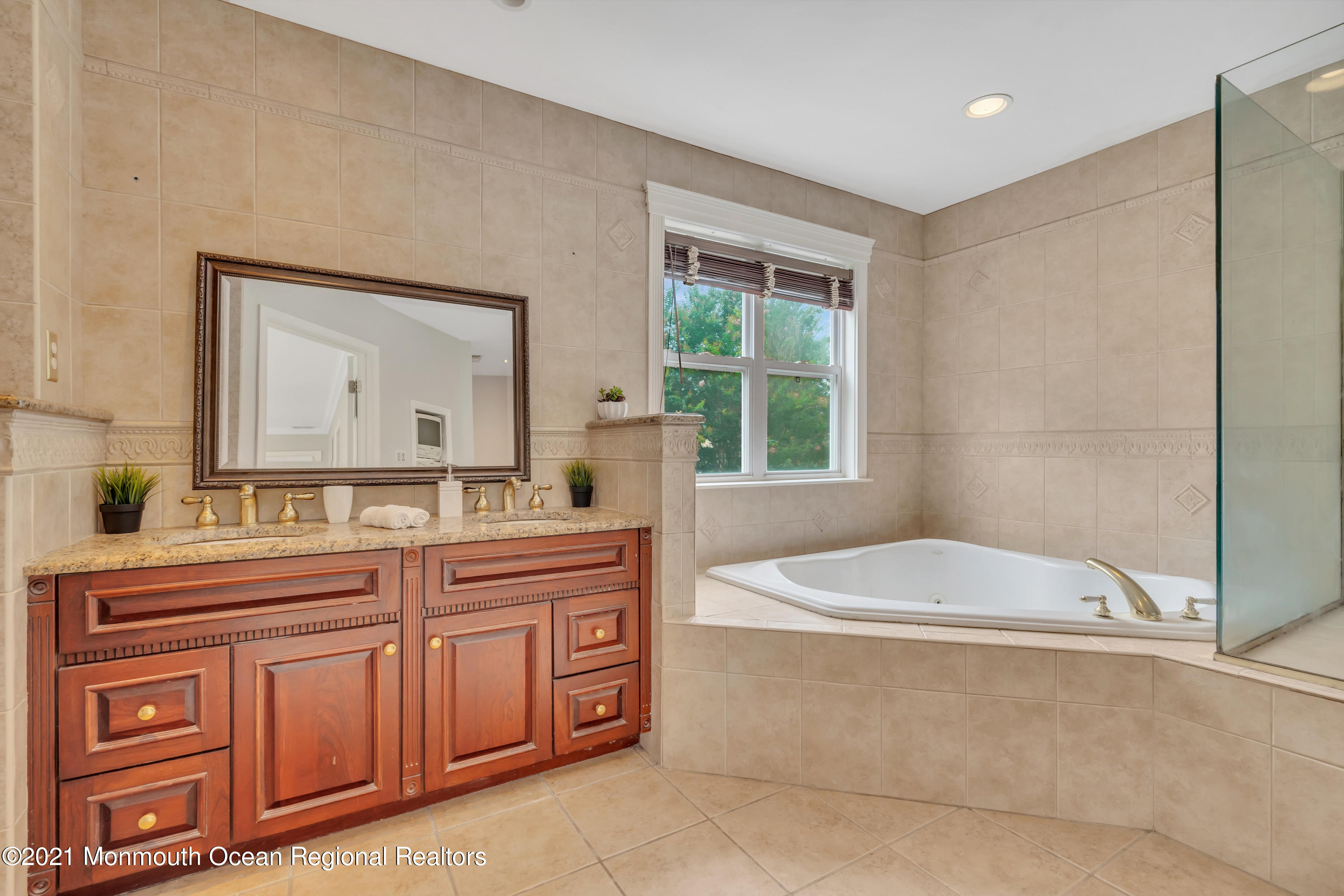 20 Highland Drive Jackson, NJ 08527 - Photo 36 of 62 a spacious bathroom with a double vanity sink a mirror and a bathtub