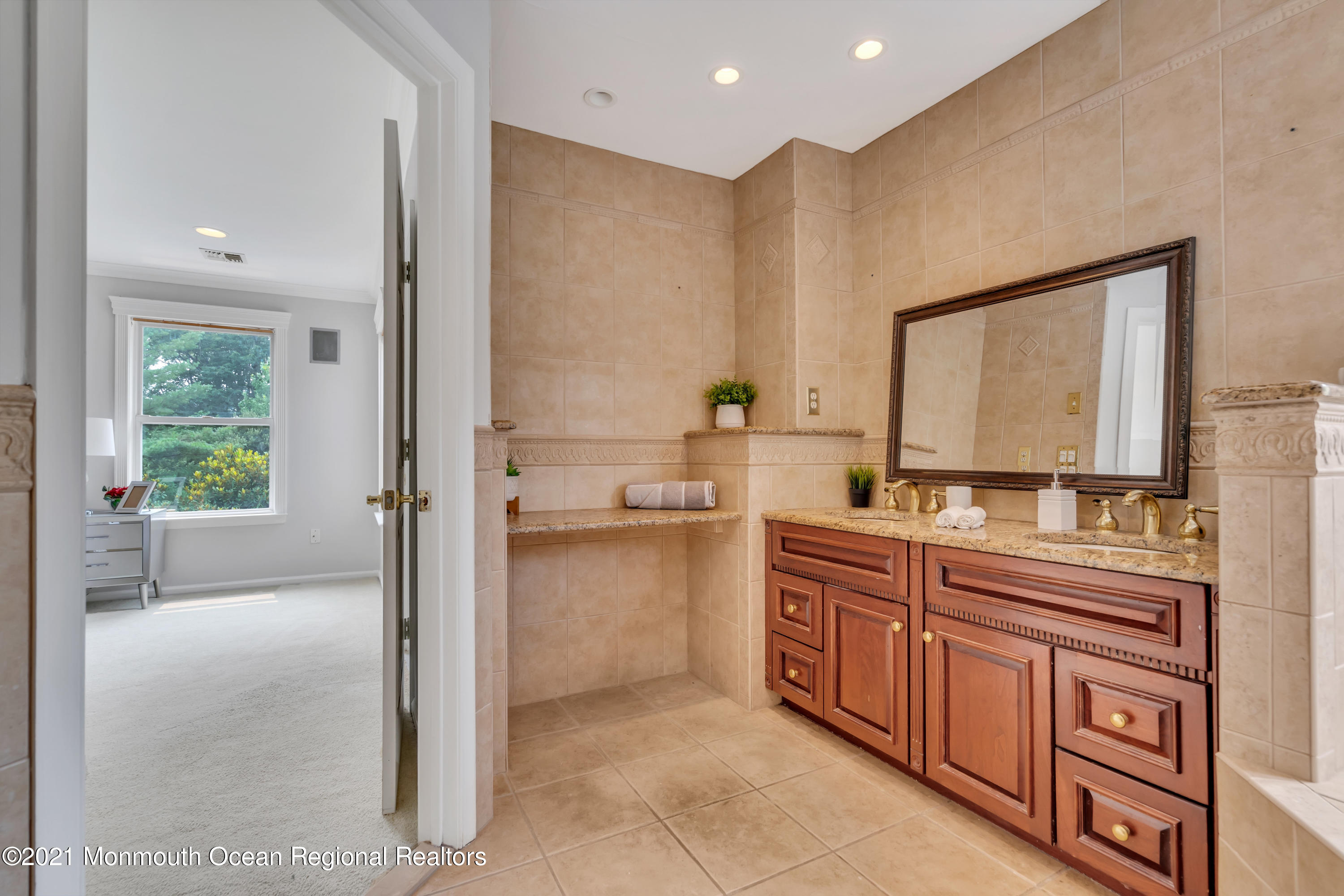 20 Highland Drive Jackson, NJ 08527 - Photo 38 of 62 a bathroom with a double vanity sink a mirror and a bathtub