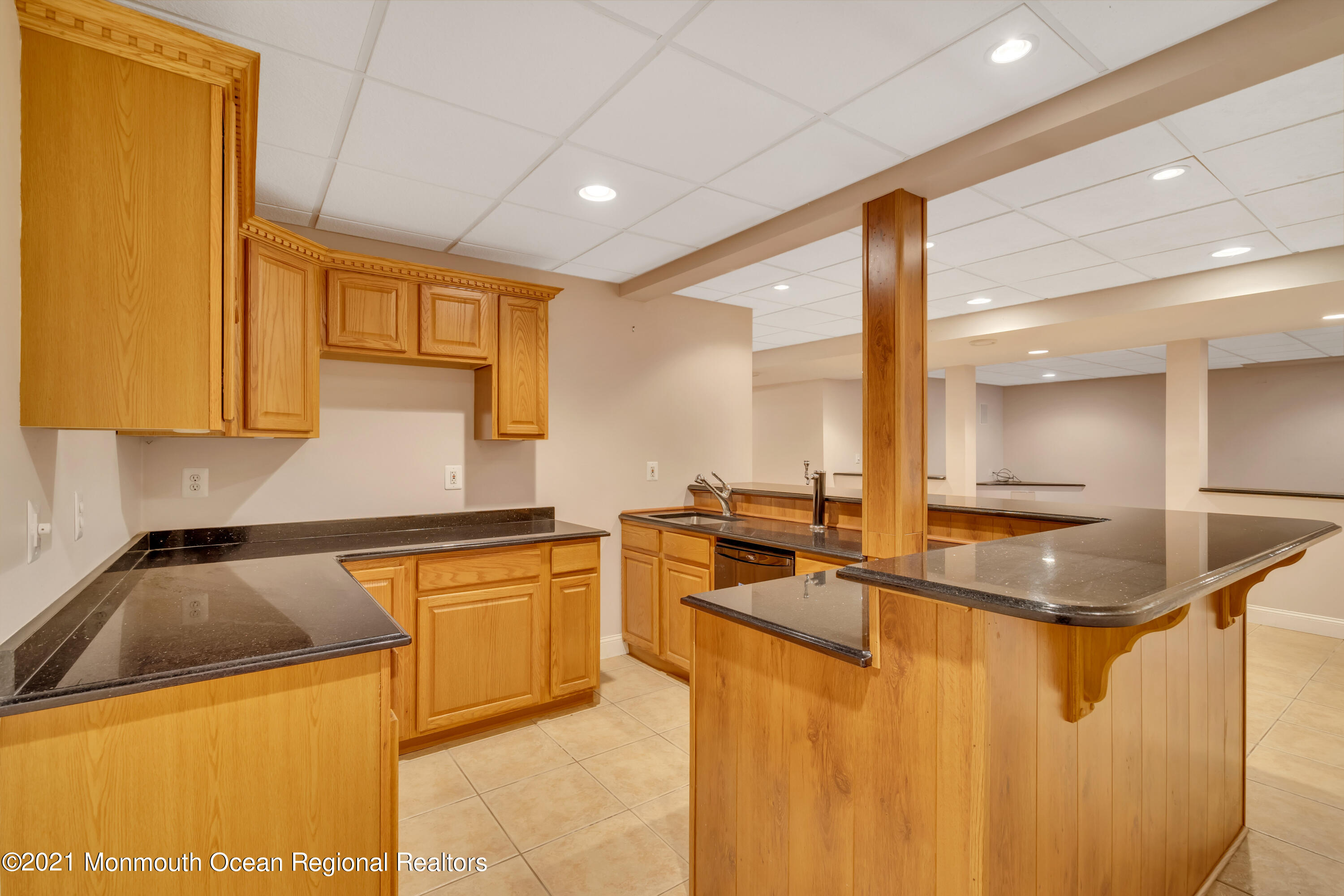 20 Highland Drive Jackson, NJ 08527 - Photo 43 of 62 a kitchen with stainless steel appliances granite countertop a sink a stove and a refrigerator