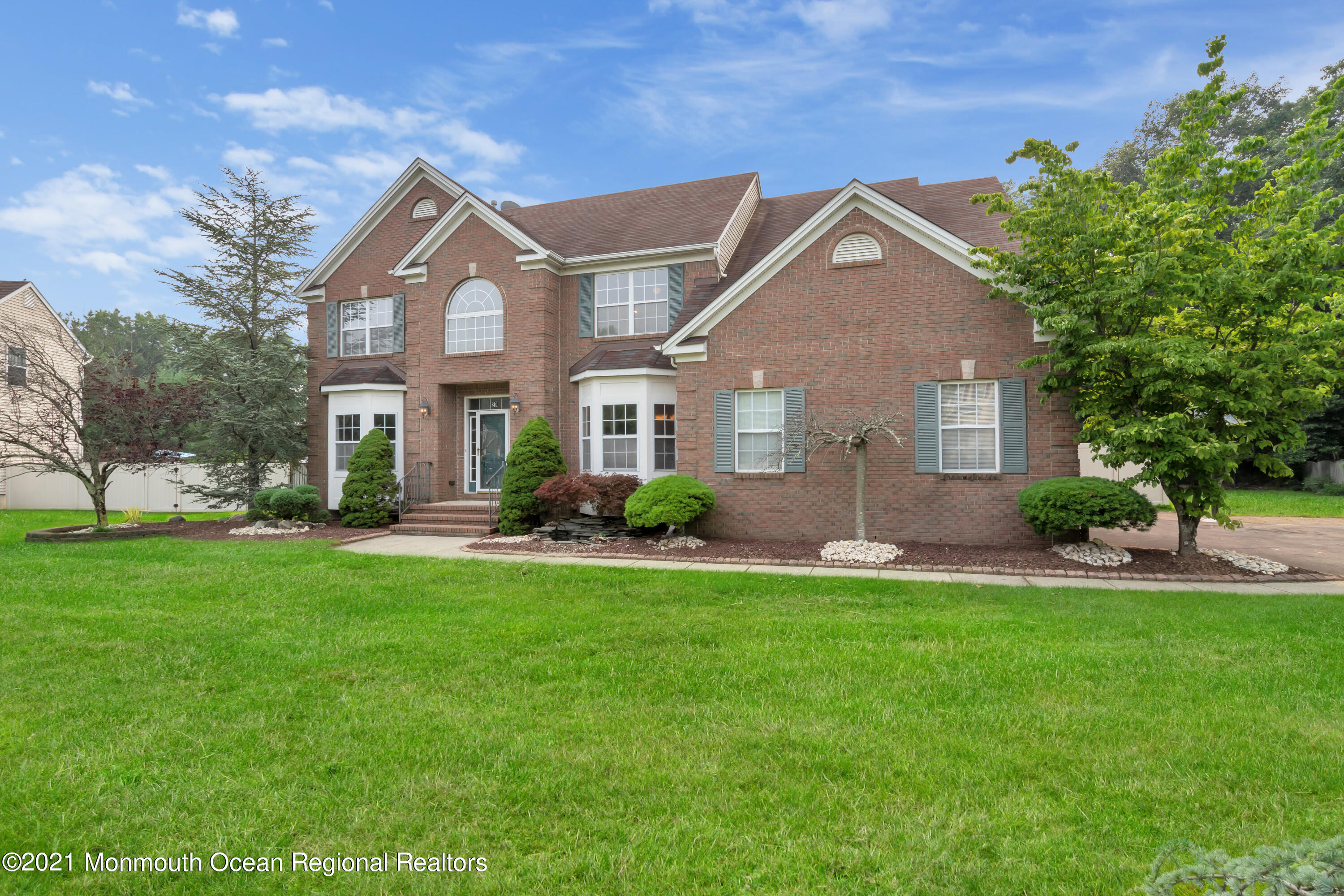 20 Highland Drive Jackson, NJ 08527 - Photo 6 of 62 a front view of a house with a yard and porch
