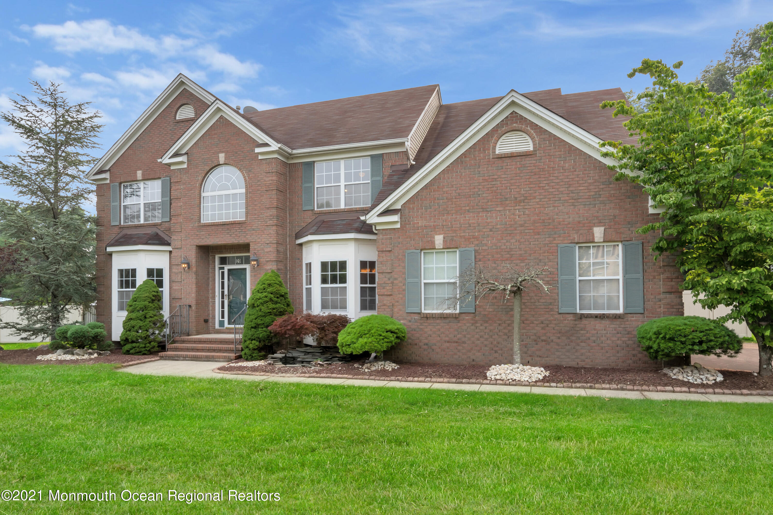 20 Highland Drive Jackson, NJ 08527 - Photo 7 of 62 a front view of a house with a yard and potted plants