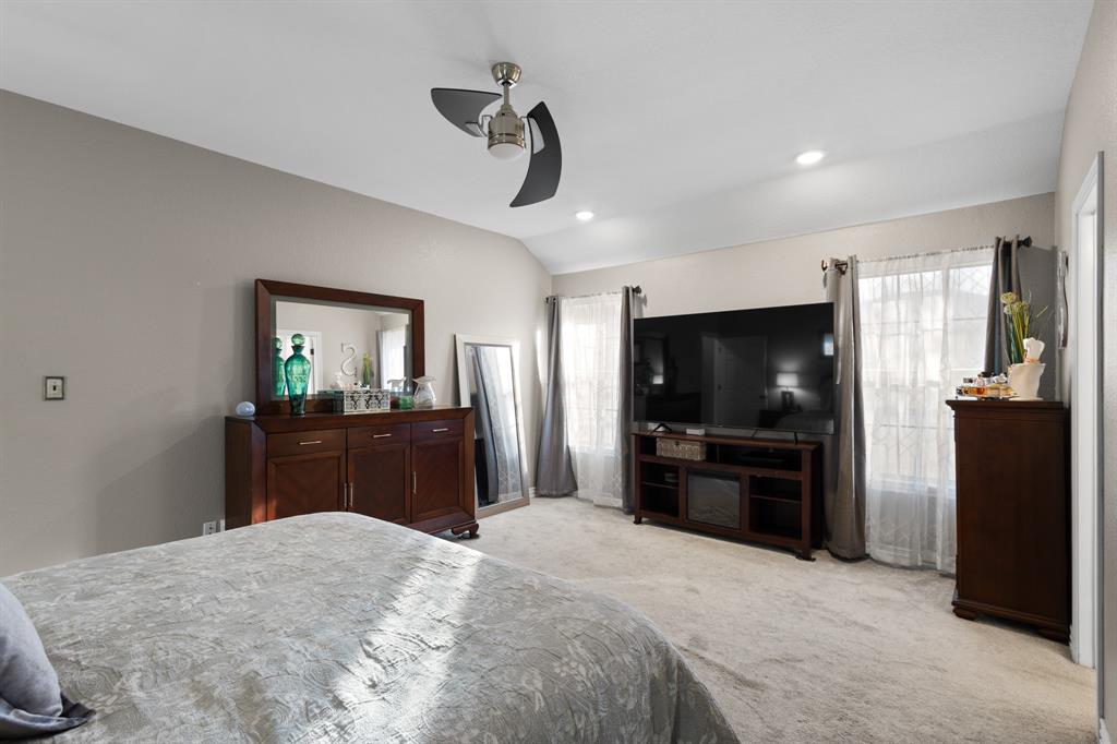 1701 Oakmeadow Drive Decatur, TX 76234 - Photo 17 of 39 a bedroom with a bed and a flat screen tv