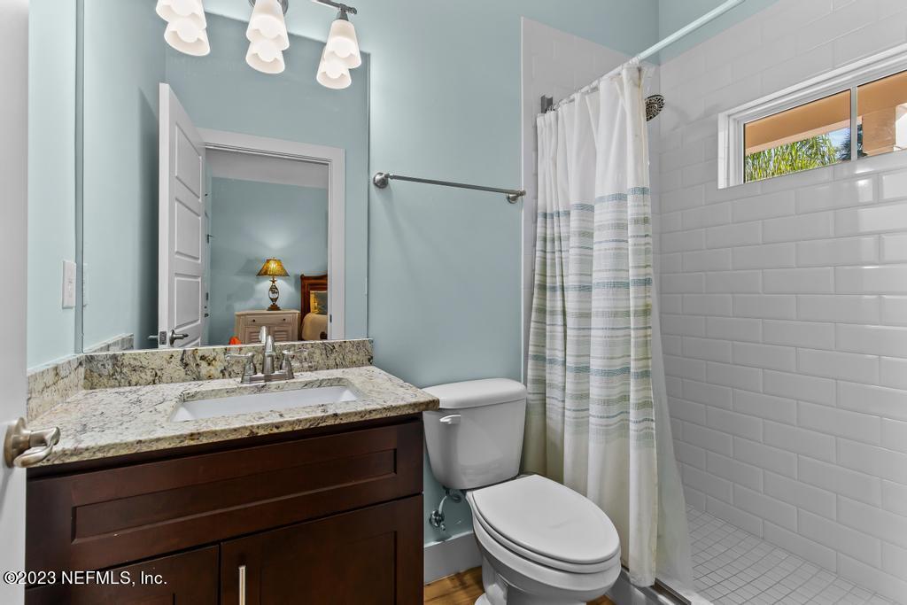 311 E Street St. Augustine, FL 32080 - Photo 17 of 40 a bathroom with a sink a toilet and shower