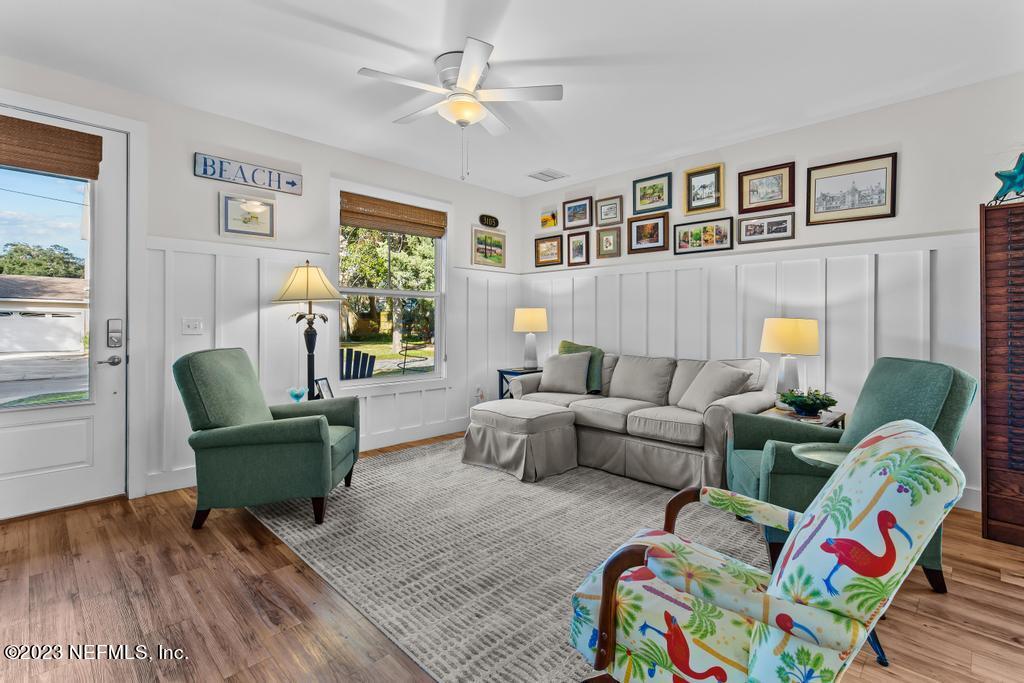 311 E Street St. Augustine, FL 32080 - Photo 6 of 40 a living room with furniture and a painting on the wall