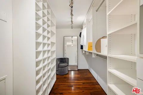 a view of staircase with white walls and a window