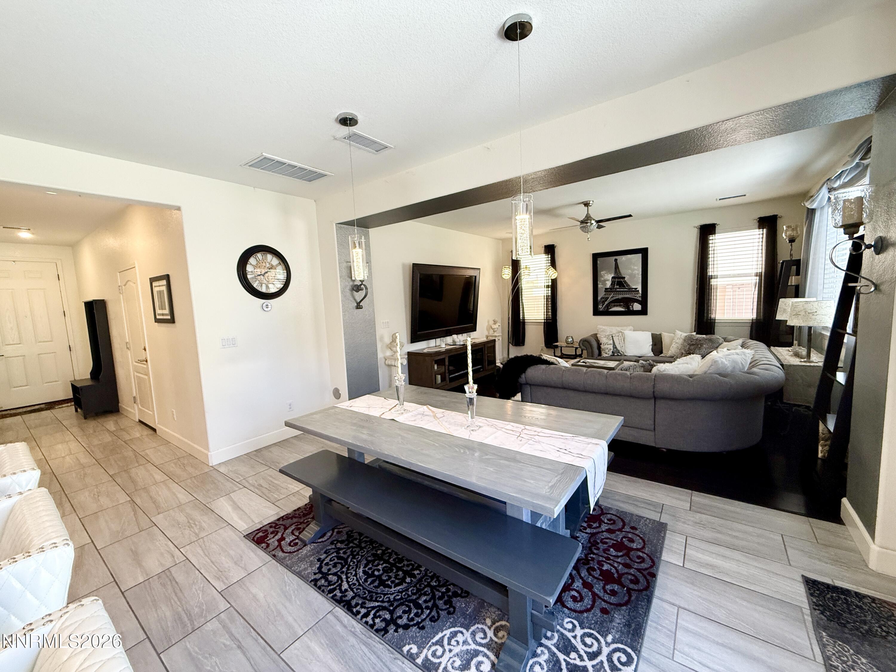 9766 Pachuca Drive Reno, NV 89521 - Photo 10 of 47 a living room with furniture and a flat screen tv