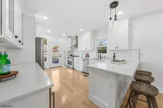 a bedroom with a bed and a night stand