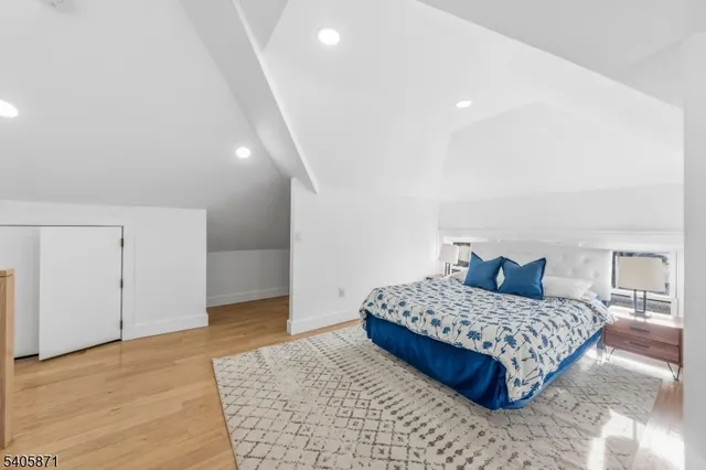 a bedroom with a bed and a walk in closet