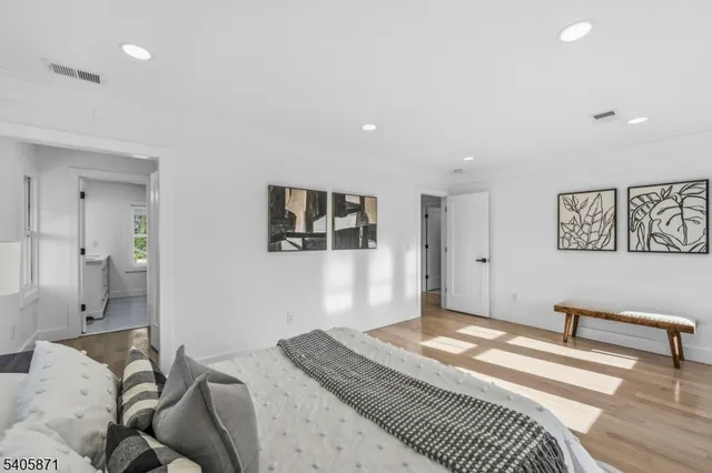 a bathroom with a shower sink and mirror