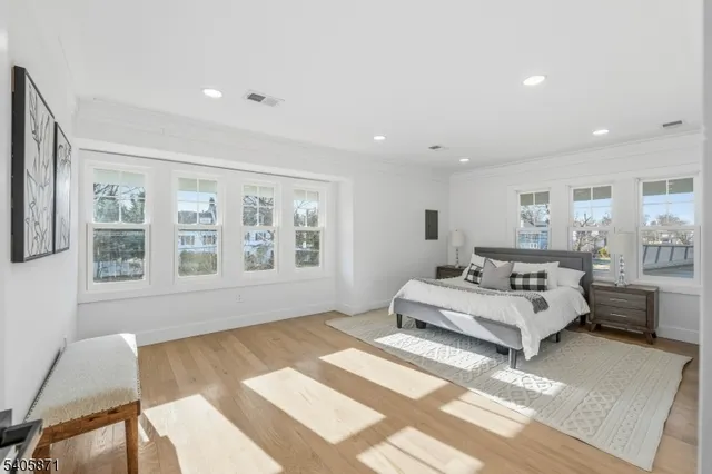 a view of a house with a yard covered in the background