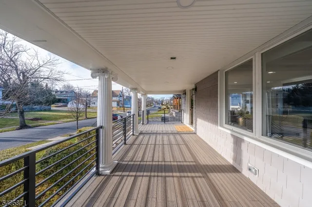 a view of a patio with wooden floor and city view
