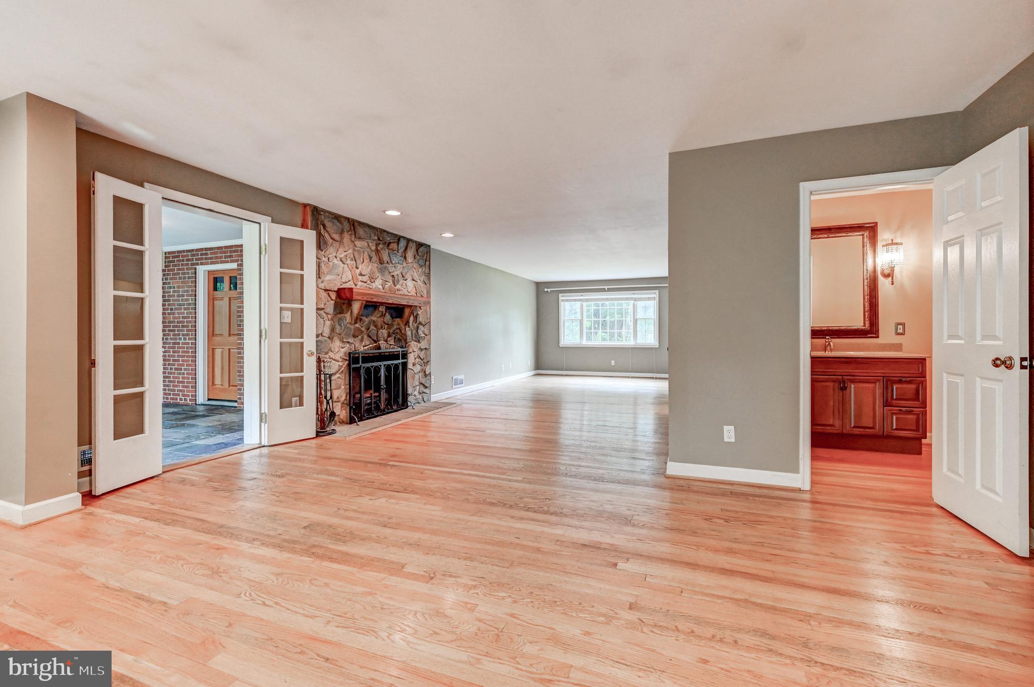 7920 Springway Road Baltimore, MD 21204 - Photo 15 of 49 a view of an empty room with wooden floor and a window