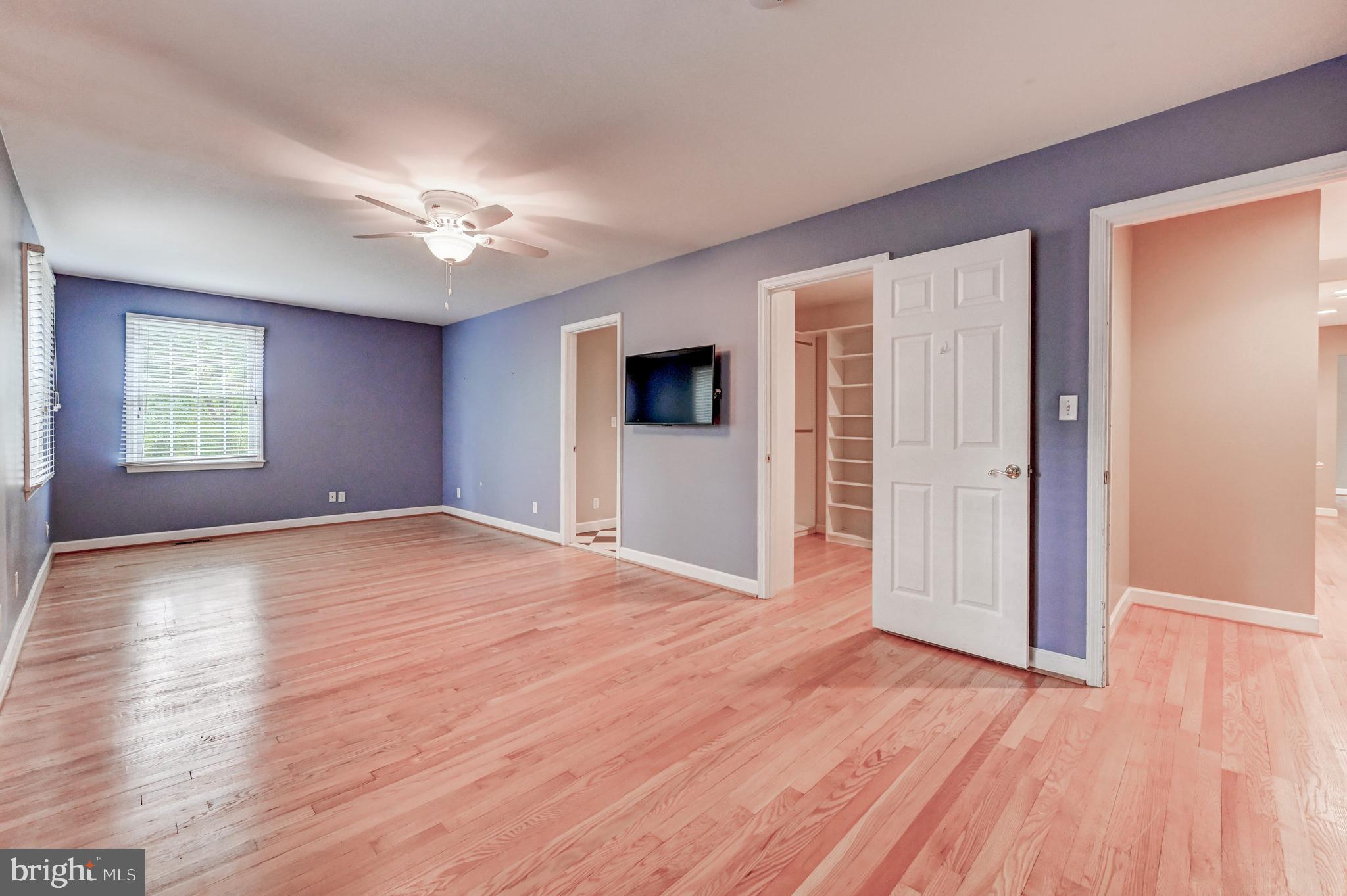 7920 Springway Road Baltimore, MD 21204 - Photo 17 of 49 an empty room with wooden floor and windows