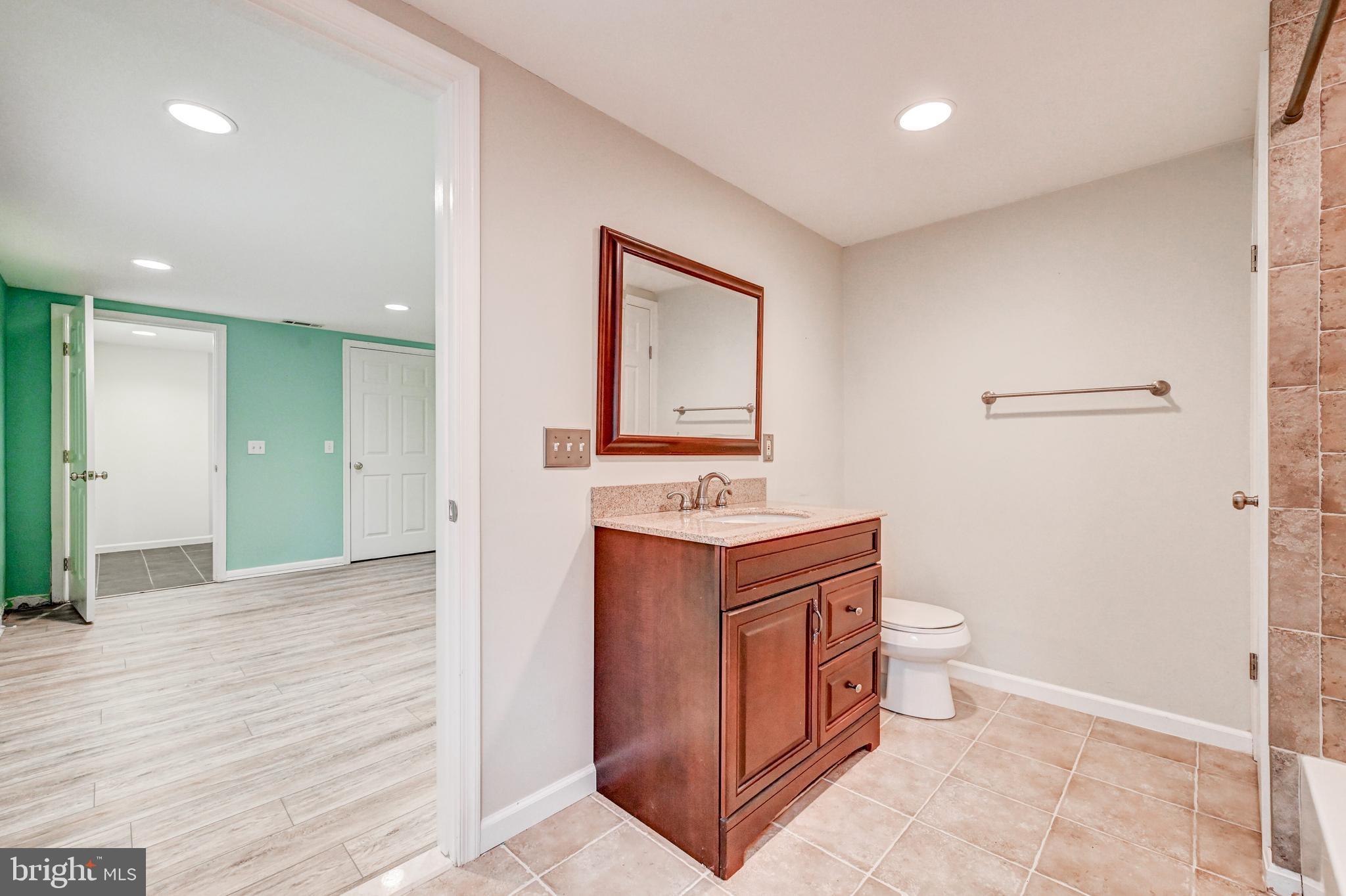 7920 Springway Road Baltimore, MD 21204 - Photo 30 of 49 a view of bathroom with a toilet sink and mirror