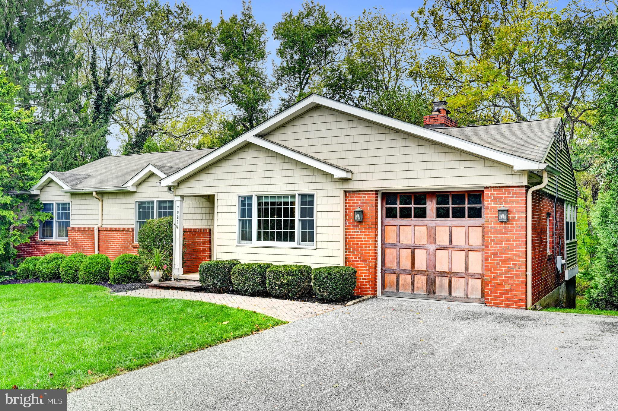 7920 Springway Road Baltimore, MD 21204 - Photo 3 of 49 a front view of a house with a garden and plants
