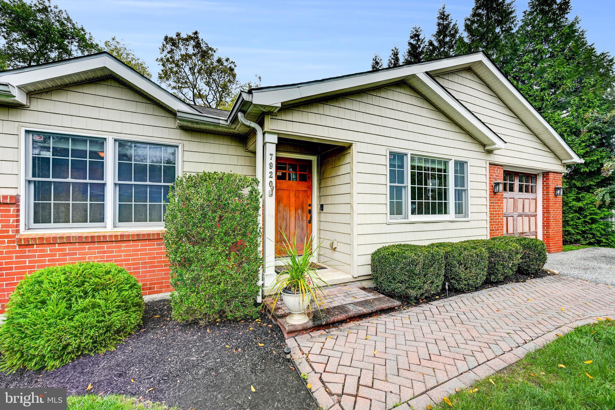 7920 Springway Road Baltimore, MD 21204 - Photo 4 of 49 a front view of a house with garden