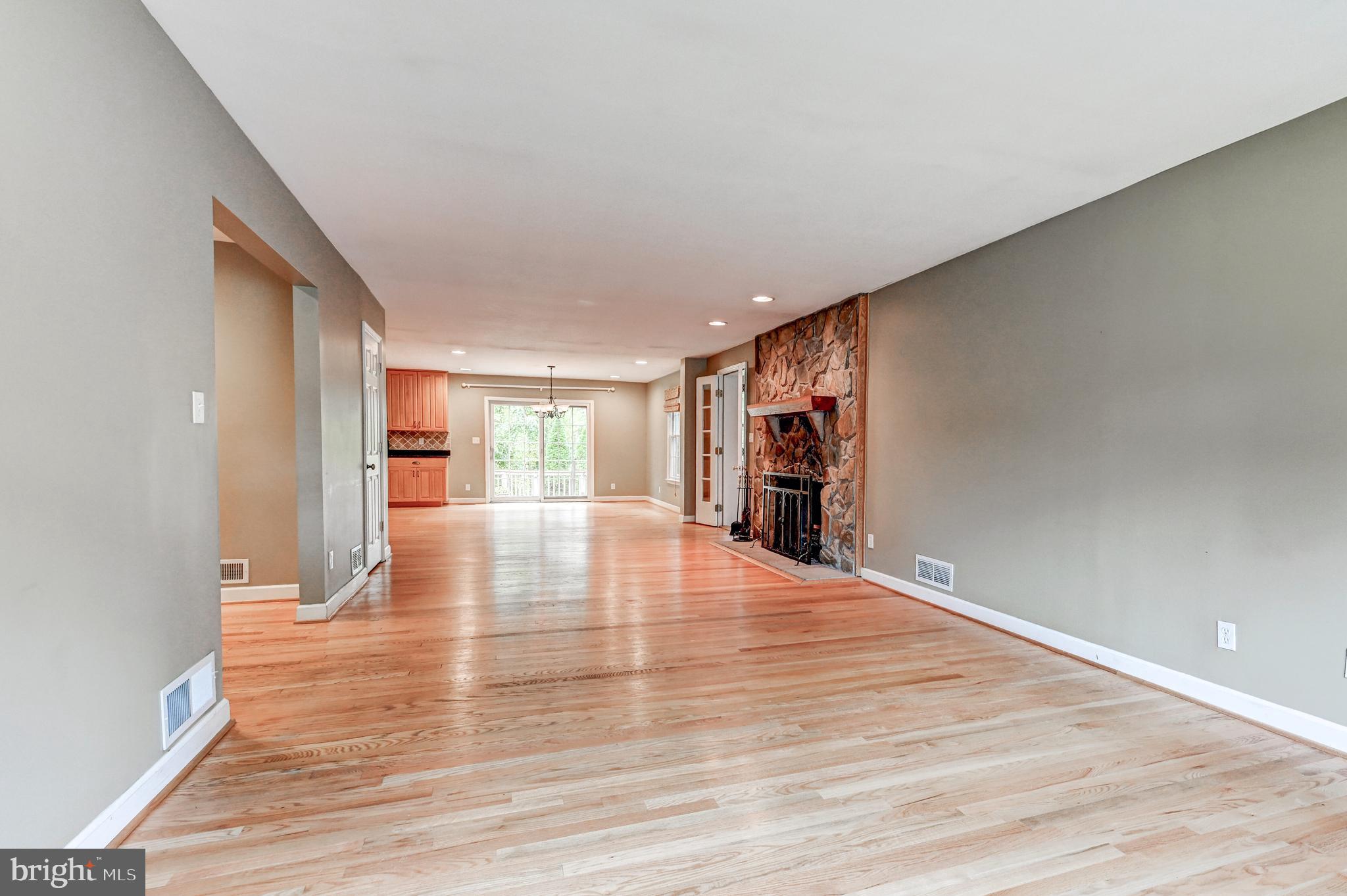 7920 Springway Road Baltimore, MD 21204 - Photo 7 of 49 a view of an empty room with wooden floor and a window