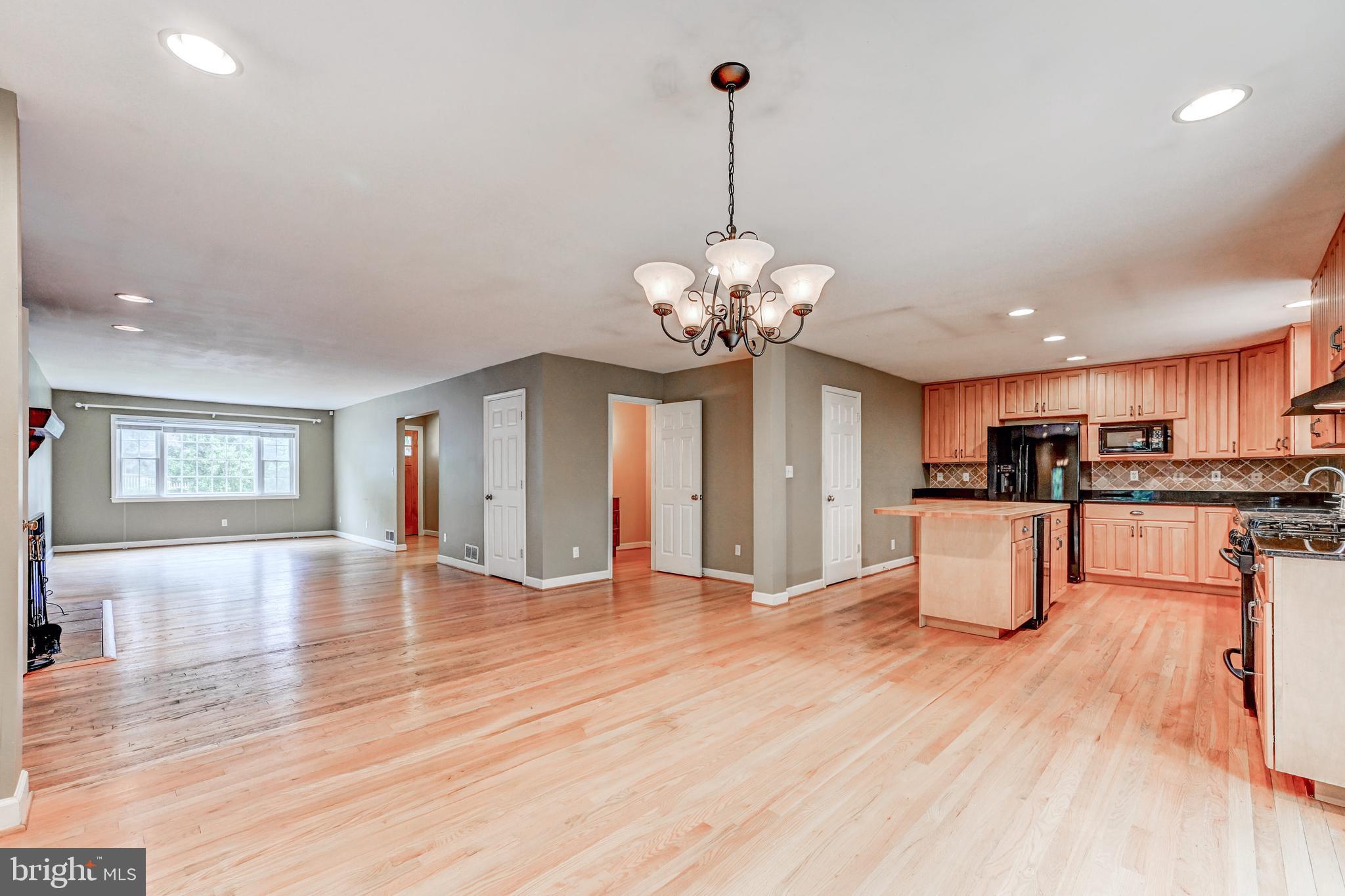 7920 Springway Road Baltimore, MD 21204 - Photo 9 of 49 a view of a kitchen with stove and wooden floor