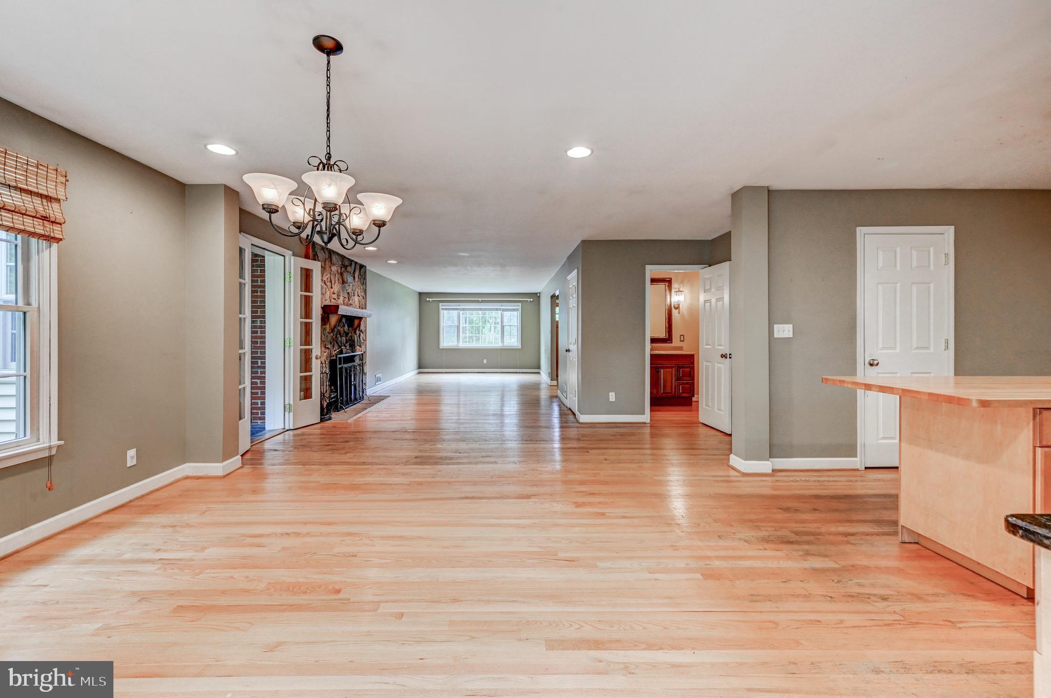 7920 Springway Road Baltimore, MD 21204 - Photo 10 of 49 a view of a livingroom with a furniture wooden floor and chandelier