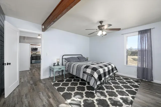 a bedroom with double bed and a window