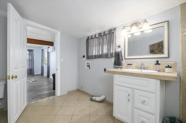 a bathroom with a sink and a mirror