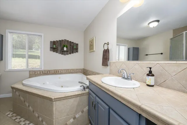 a bathroom with a sink and a bathtub