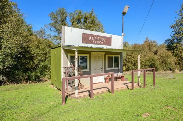 a view of a swimming pool with a table and chairs