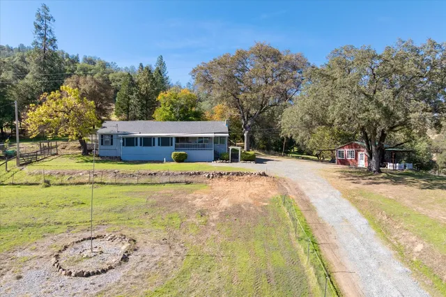 a house with swimming pool in front of it