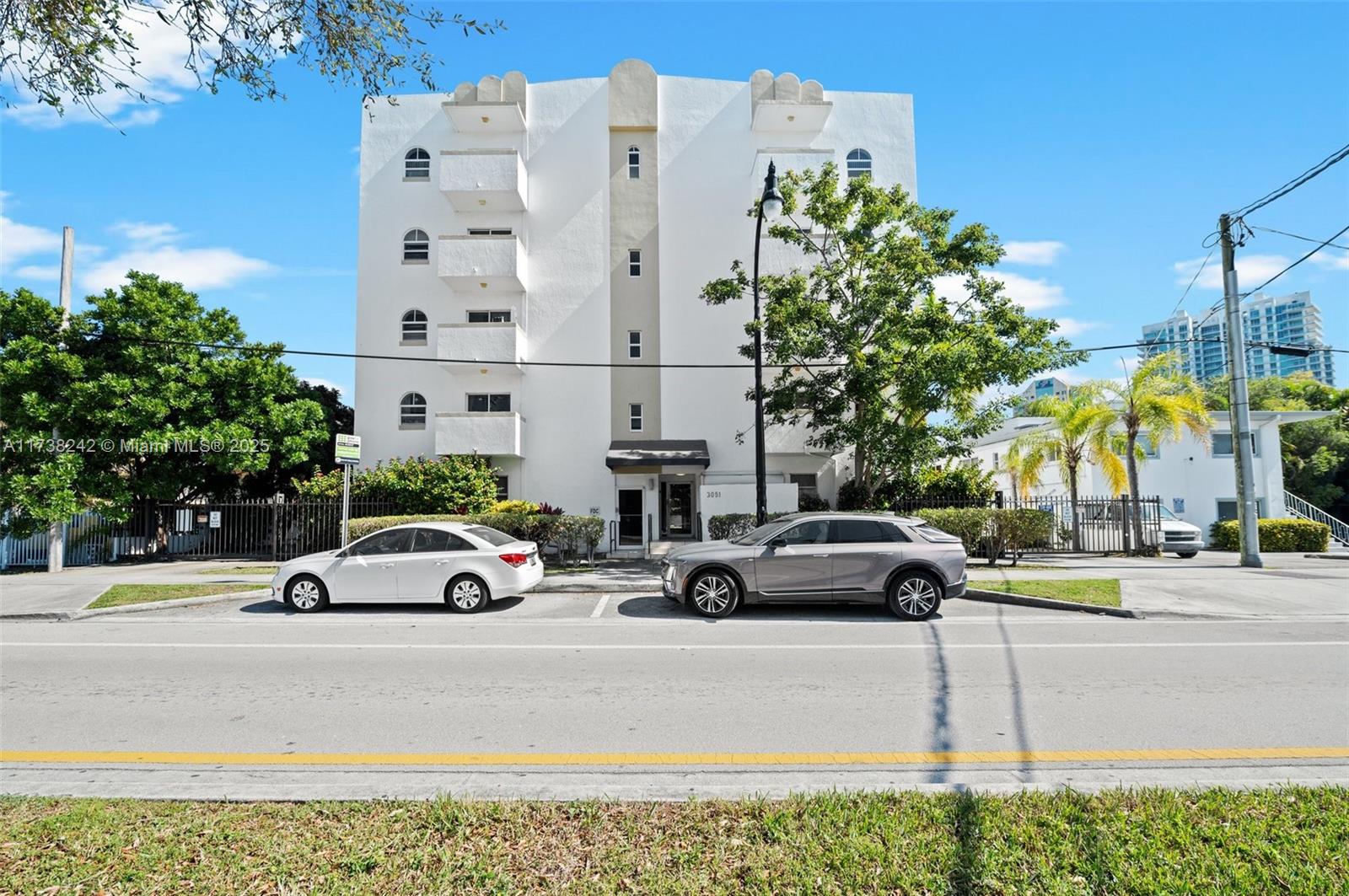 3051 Southwest 27th Avenue, Unit 302 Miami, FL 33133 - Photo 18 of 19 a view of street with parked cars