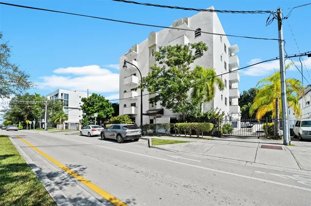 a view of a street with cars on it