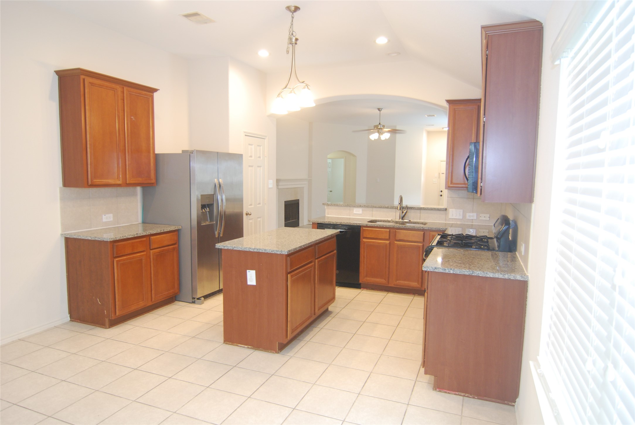 2834 Lockeridge Pines Drive Spring, TX 77386 - Photo 4 of 20 Another view of the kitchen - tiled floors for easy maintenance.