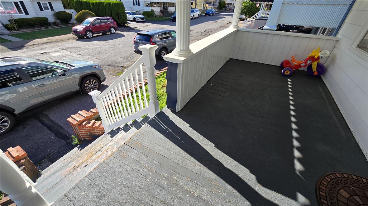883 North Locust Street Hazleton, PA 18201 - Photo 72 of 83 A classic front porch offers outdoor relaxation, with street parking for residents and guests.