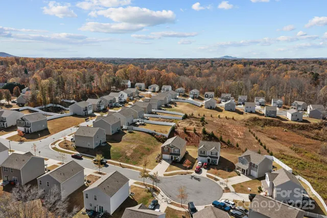 a front view of a house with plants