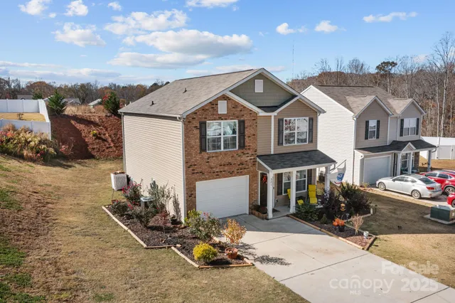 a front view of a house with sitting area