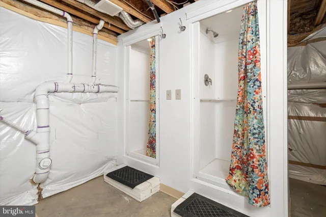 a bathroom with a shower and a sink