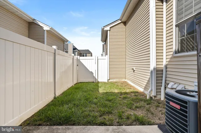 a view of a backyard with pathway