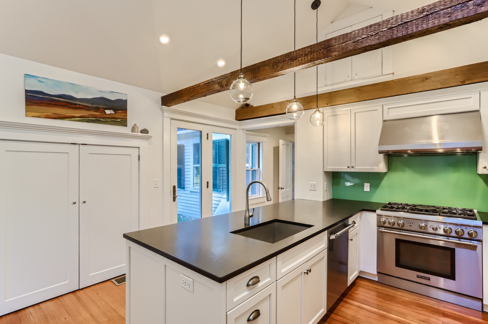 16 S Road Chilmark, MA 02535 - Photo 14 of 50 a kitchen with stainless steel appliances granite countertop a stove a sink and a microwave