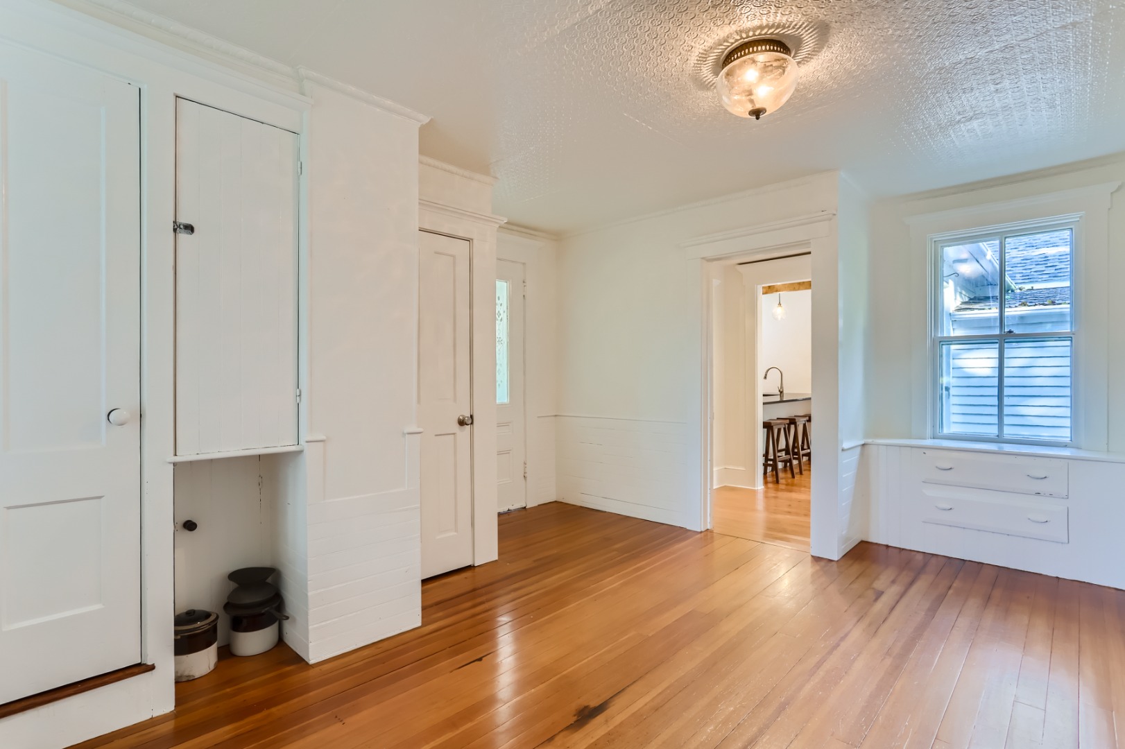16 S Road Chilmark, MA 02535 - Photo 16 of 50 an empty room with wooden floor and windows