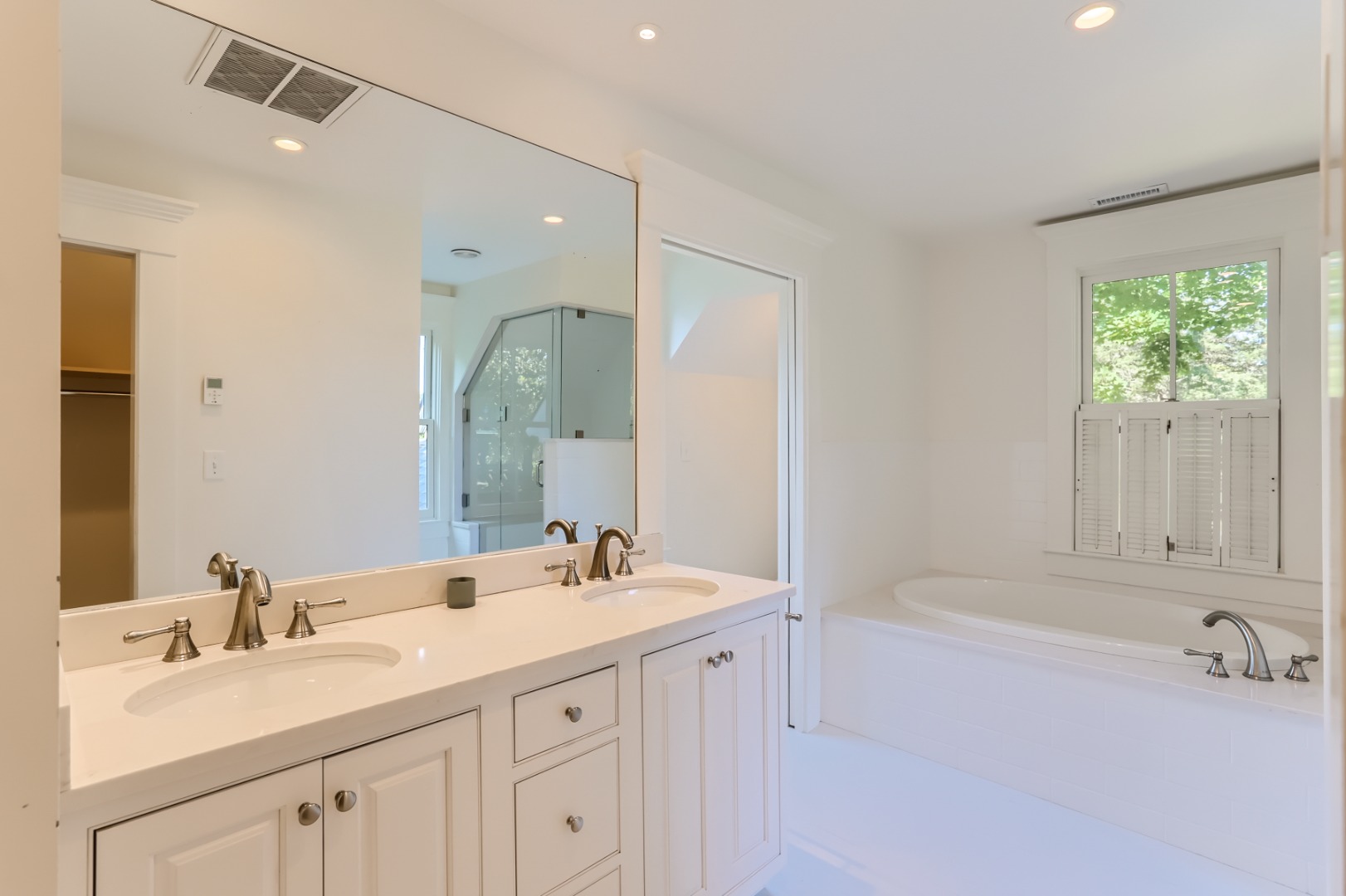 16 S Road Chilmark, MA 02535 - Photo 29 of 50 a bathroom with a sink double vanity and a mirror