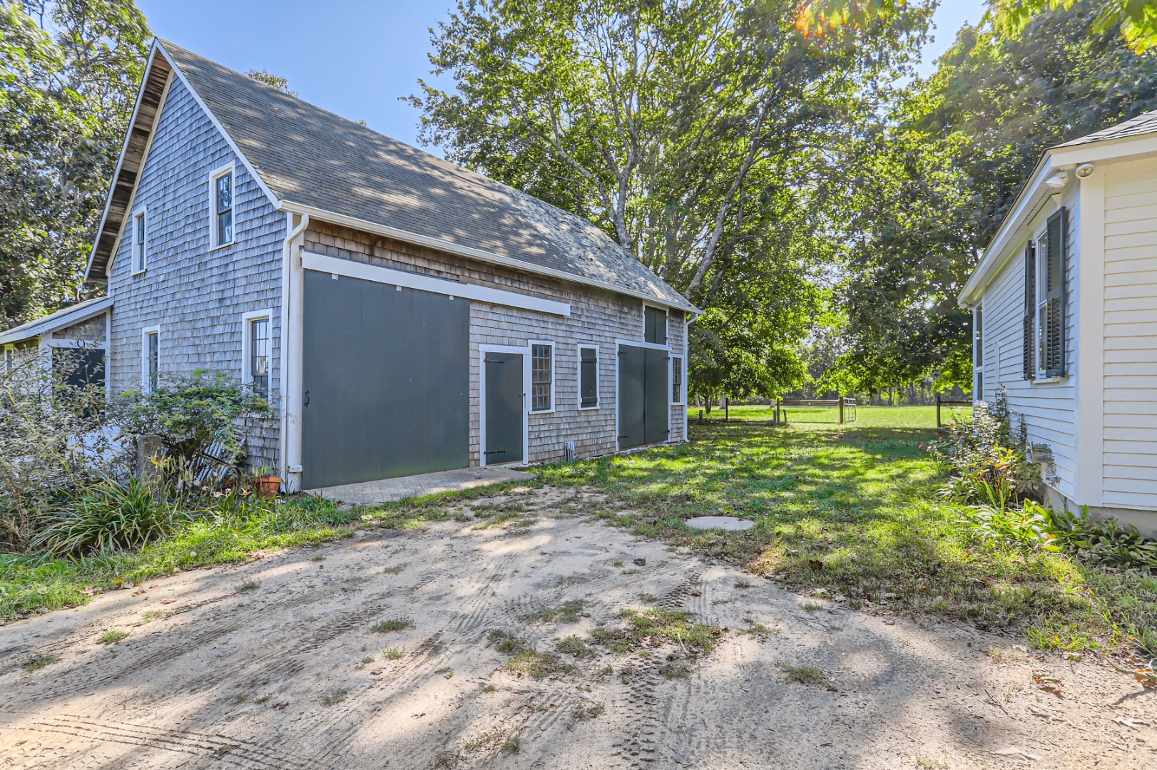 16 S Road Chilmark, MA 02535 - Photo 35 of 50 a view of a house with yard and plants