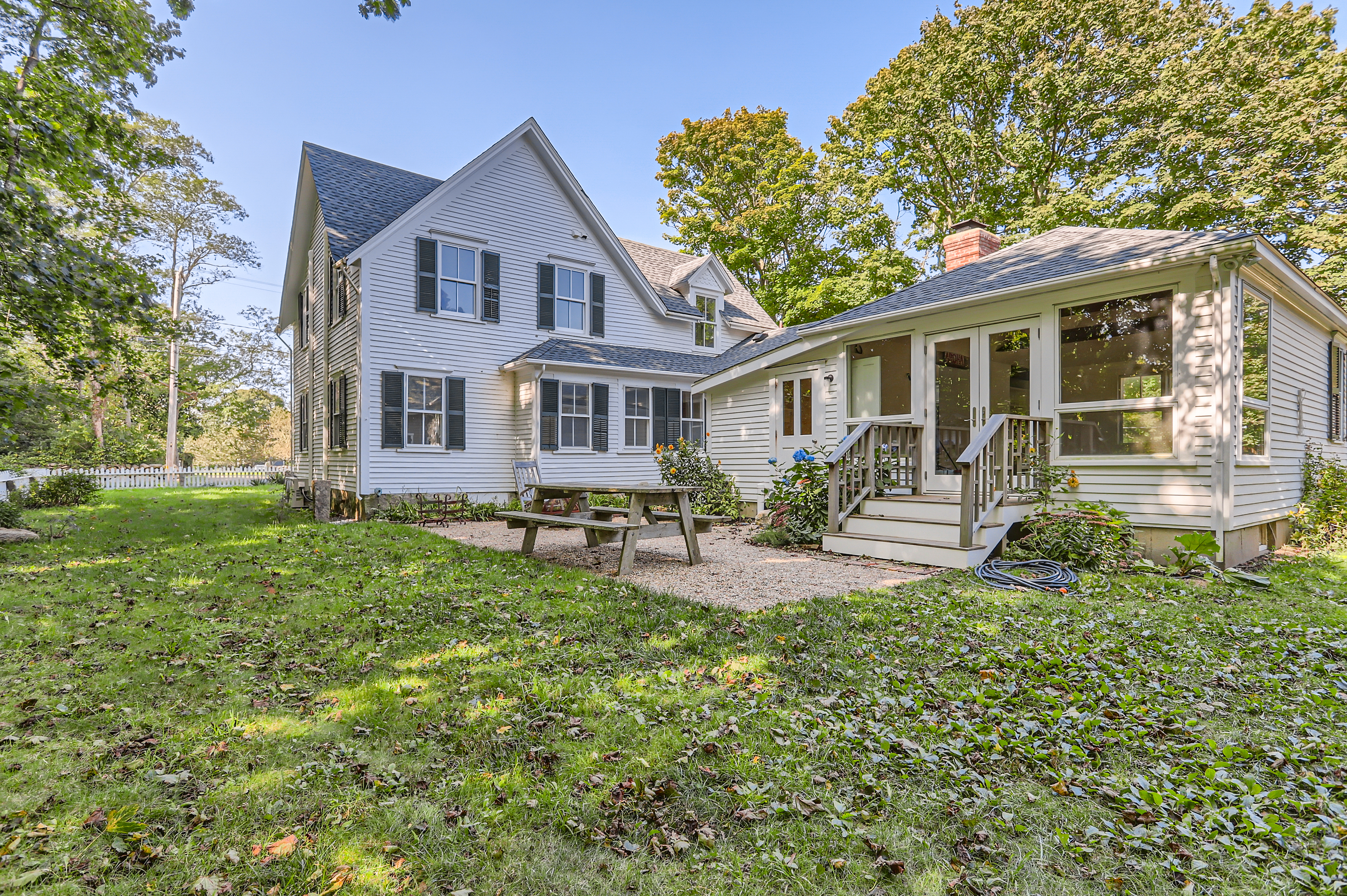 16 S Road Chilmark, MA 02535 - Photo 38 of 50 a front view of a house with a yard and porch