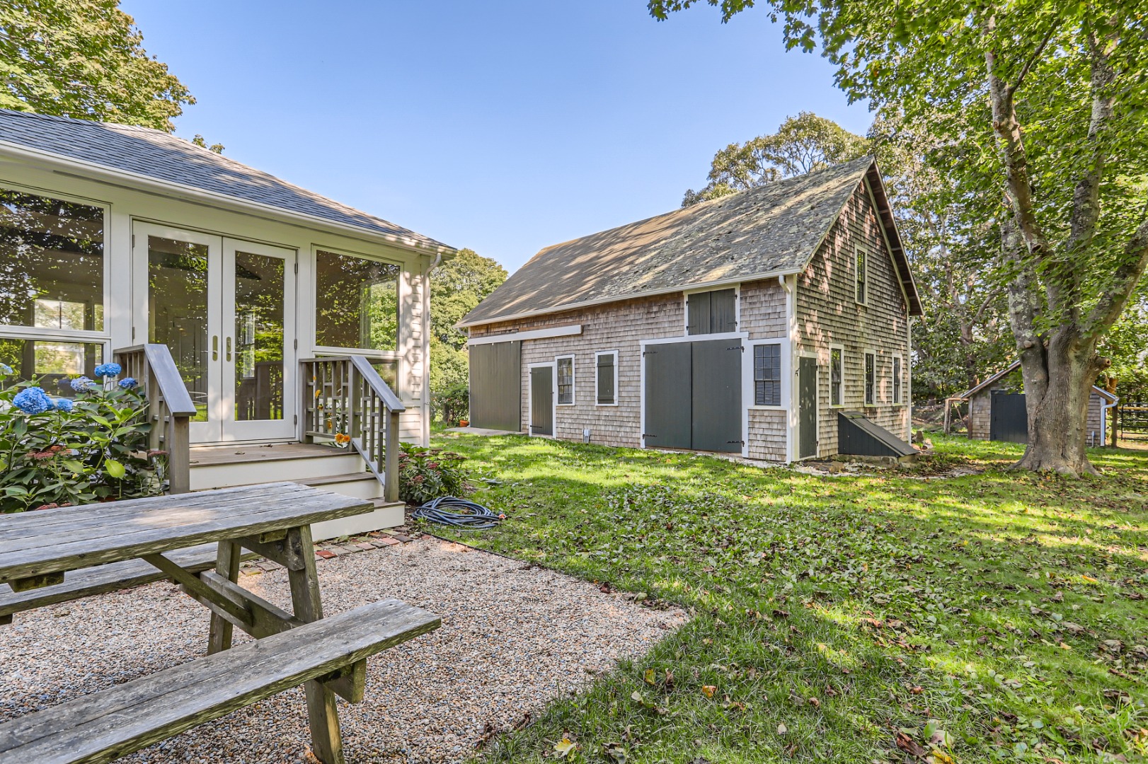 16 S Road Chilmark, MA 02535 - Photo 39 of 50 a view of a house with backyard and sitting area