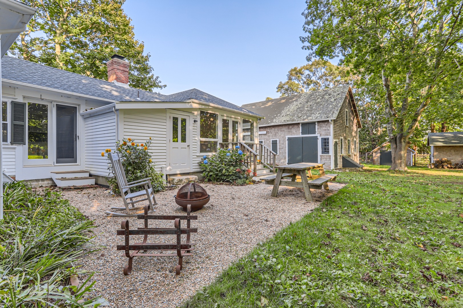 16 S Road Chilmark, MA 02535 - Photo 40 of 50 a view of a house with backyard sitting area and garden