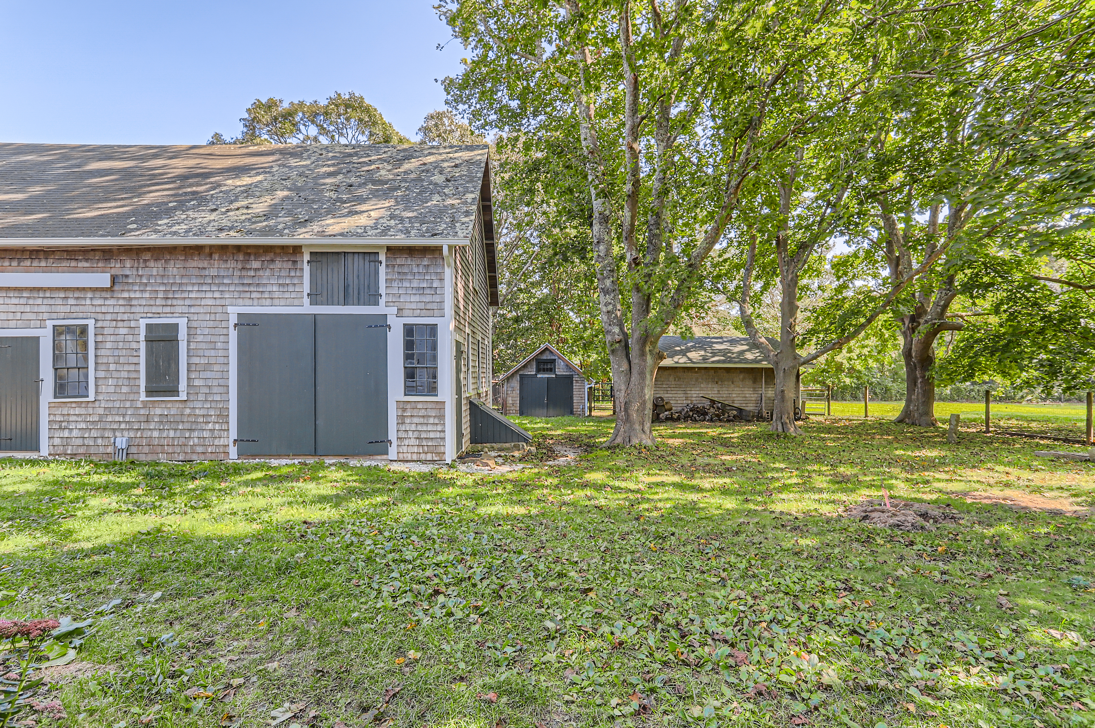 16 S Road Chilmark, MA 02535 - Photo 41 of 50 a view of a house with a yard