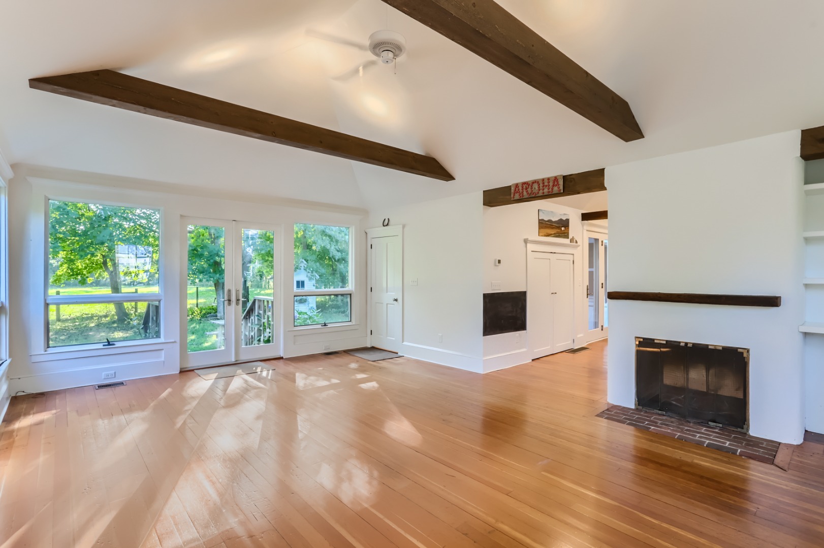 16 S Road Chilmark, MA 02535 - Photo 8 of 50 a view of empty room with wooden floor and fireplace