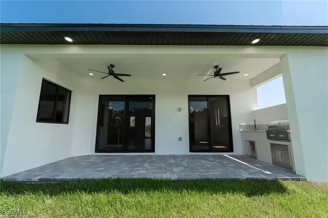 a close view of a sink and a stove in a kitchen