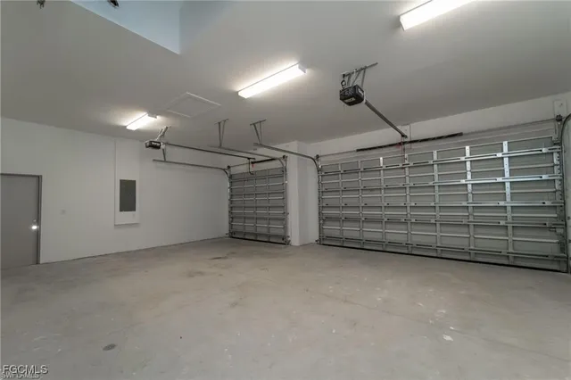 a view of an empty room with storage and utility room