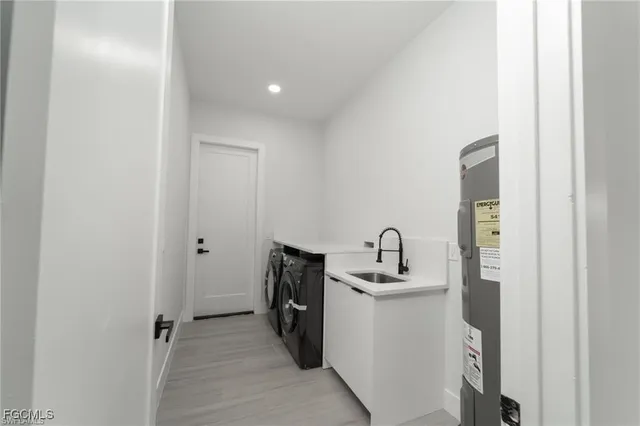 a kitchen with a sink and a refrigerator