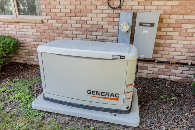 a front view of a house with yard and patio